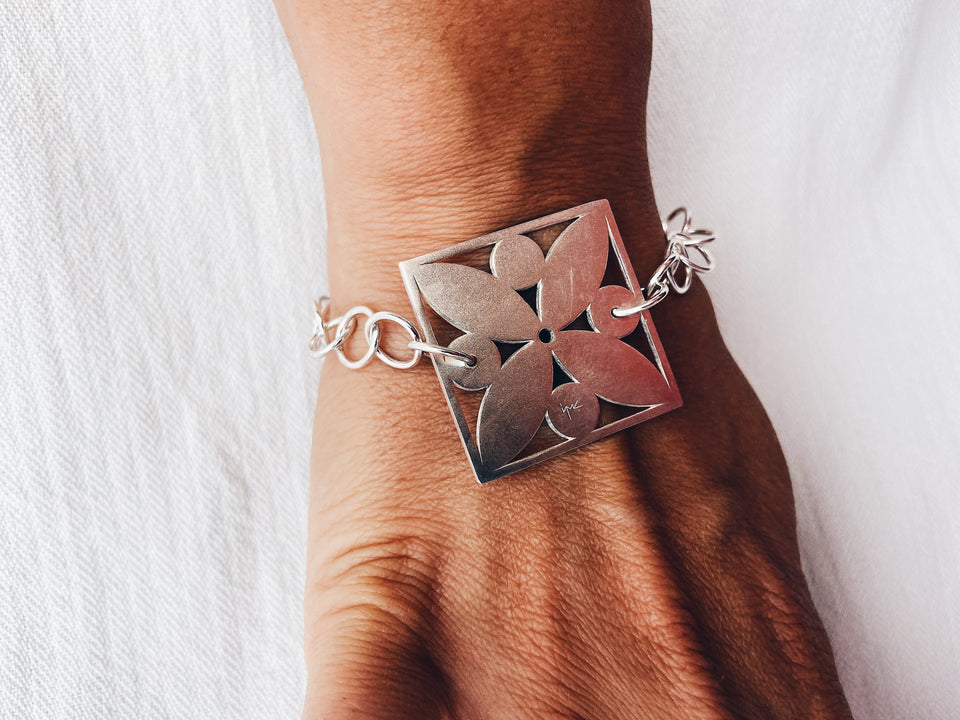 Square framed flower with circles bracelet