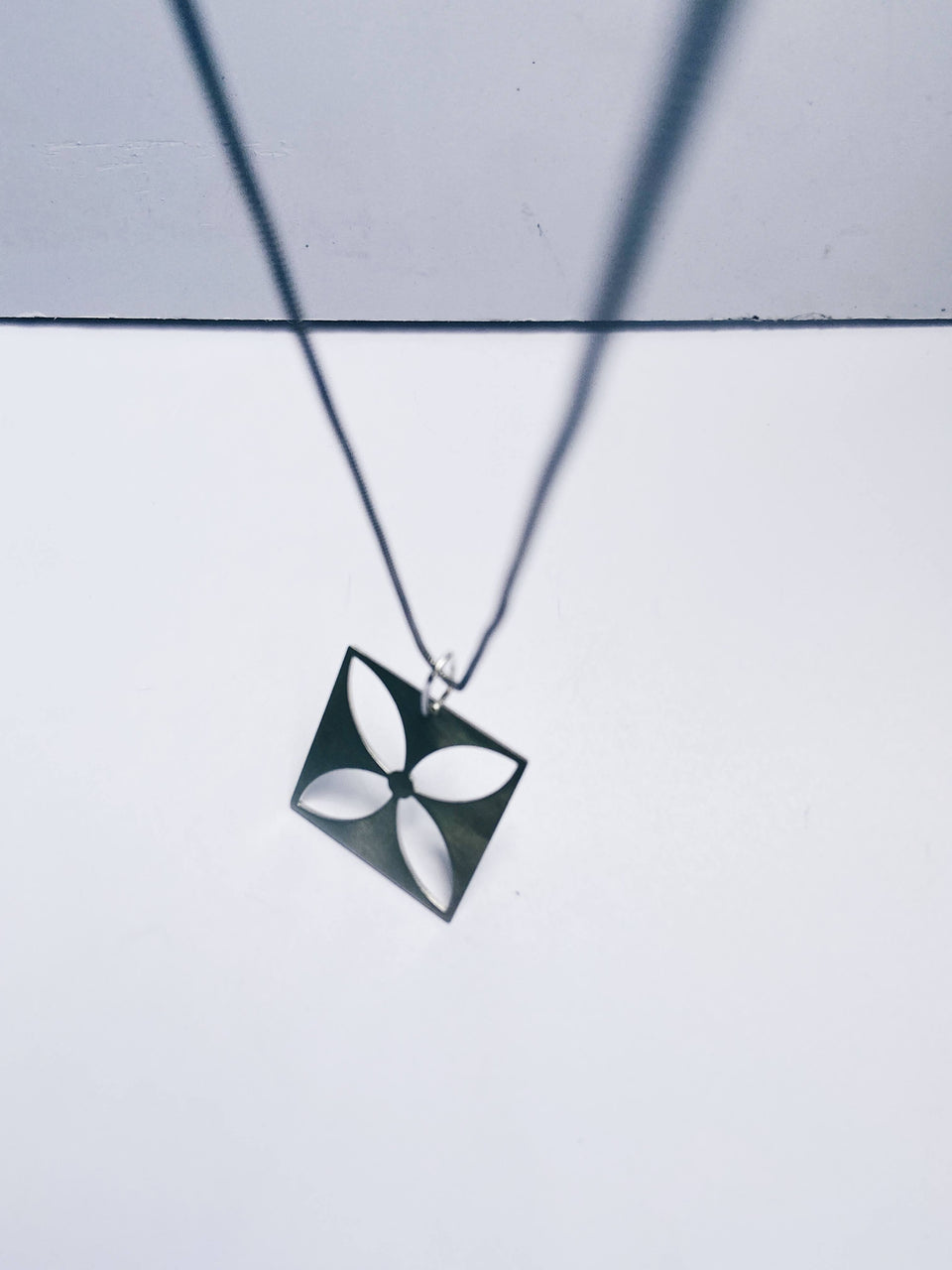 Square flower four-leafed pendant