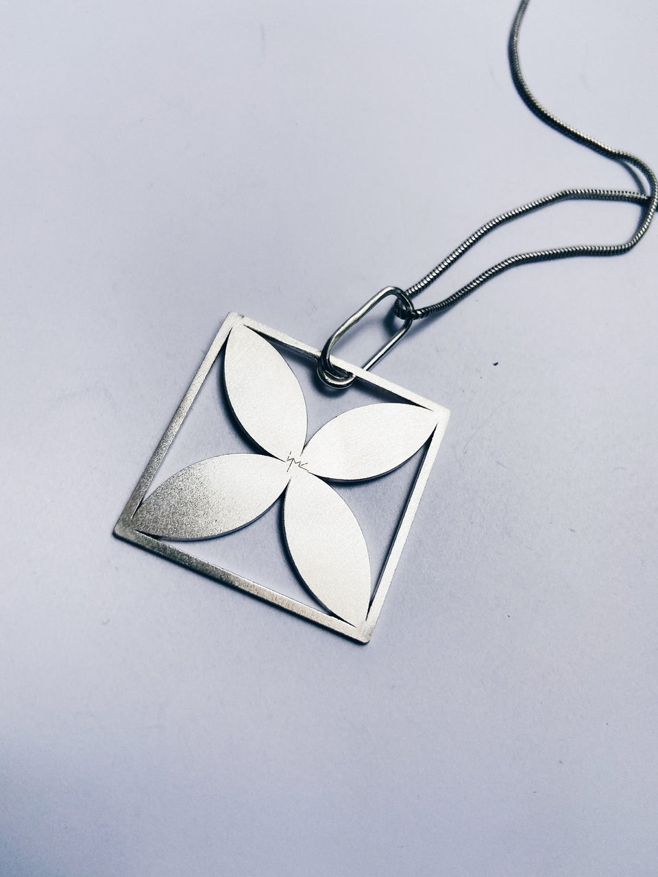 Square framed four-leafed pendant